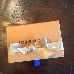Authentic Louis Vuitton slide box with original ribbon